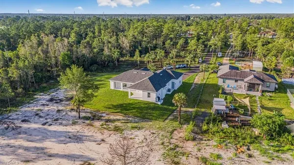 a aerial view of a house with a yard