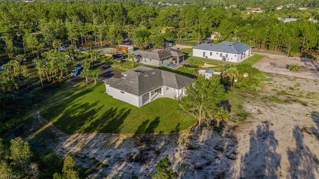 2941 37th Avenue Northeast Naples, FL 34120 - Photo 10 of 46 a aerial view of a house with a yard