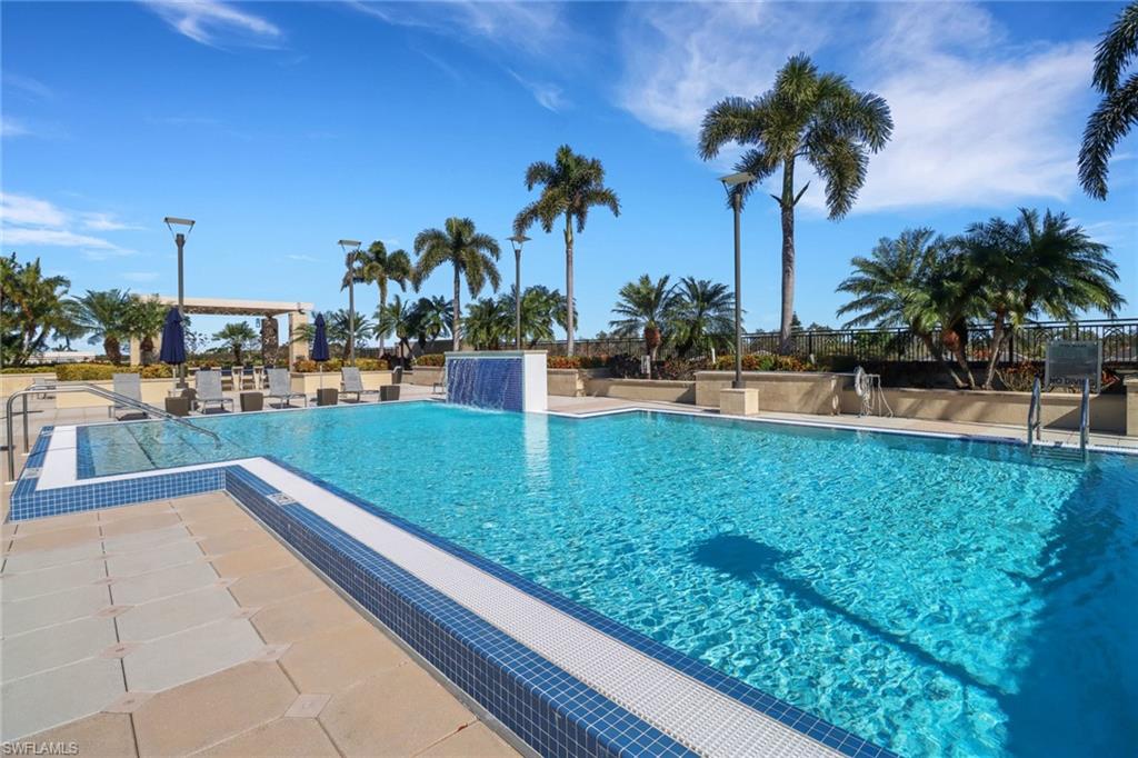 9123 Strada Place, Unit 7216 Naples, FL 34108 - Photo 18 of 28 Community pool featuring a patio