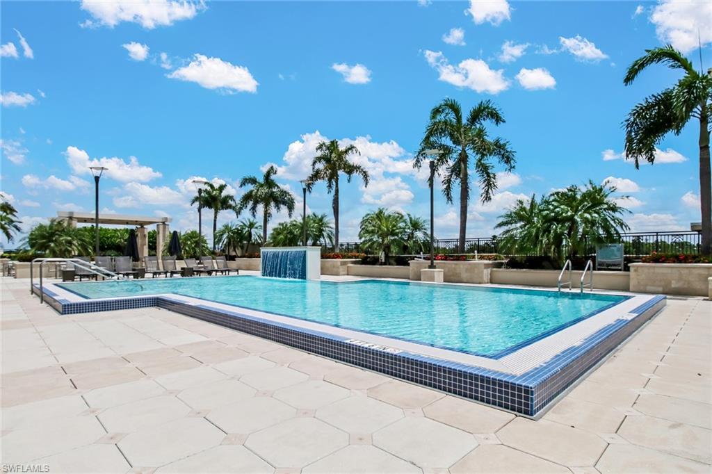 9123 Strada Place, Unit 7216 Naples, FL 34108 - Photo 19 of 28 Community pool with a patio