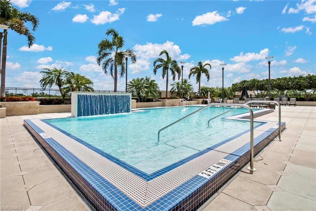 9123 Strada Place, Unit 7216 Naples, FL 34108 - Photo 20 of 28 Community pool featuring a patio area