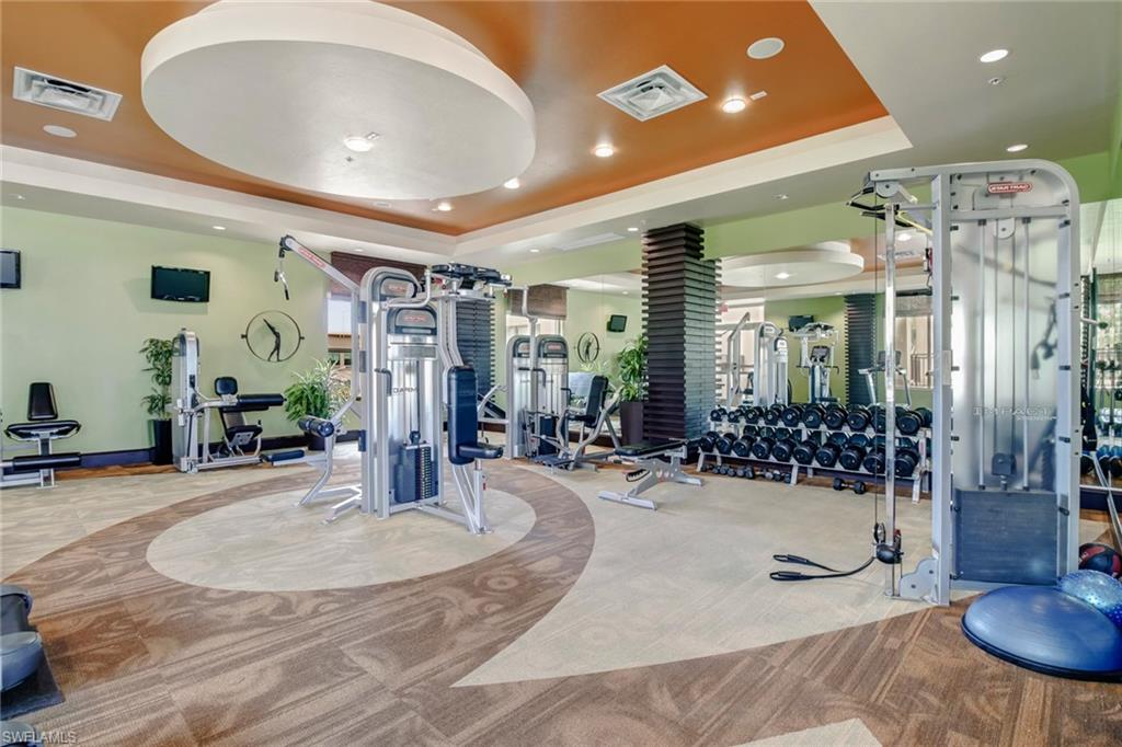9123 Strada Place, Unit 7216 Naples, FL 34108 - Photo 21 of 28 Workout area with a tray ceiling and recessed lighting