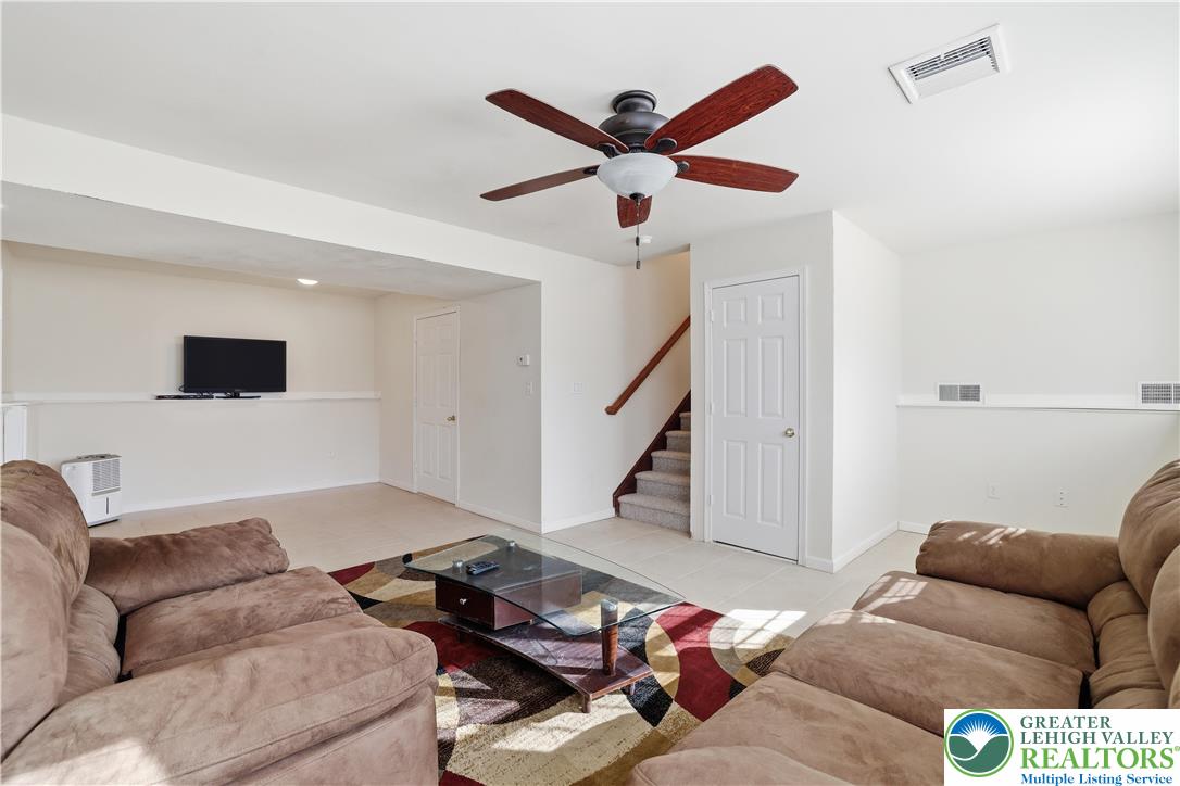 112 Amos Circle Bushkill, PA 18324 - Photo 14 of 52 a living room with furniture and a ceiling fan