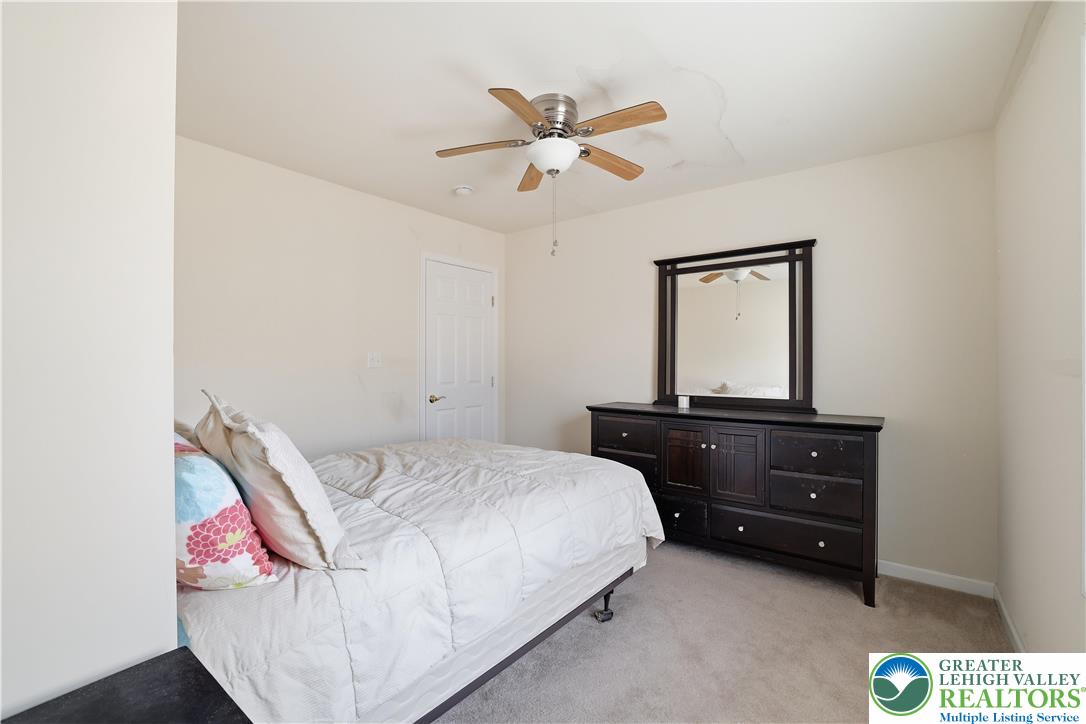 112 Amos Circle Bushkill, PA 18324 - Photo 18 of 52 a bedroom with a bed and a dresser