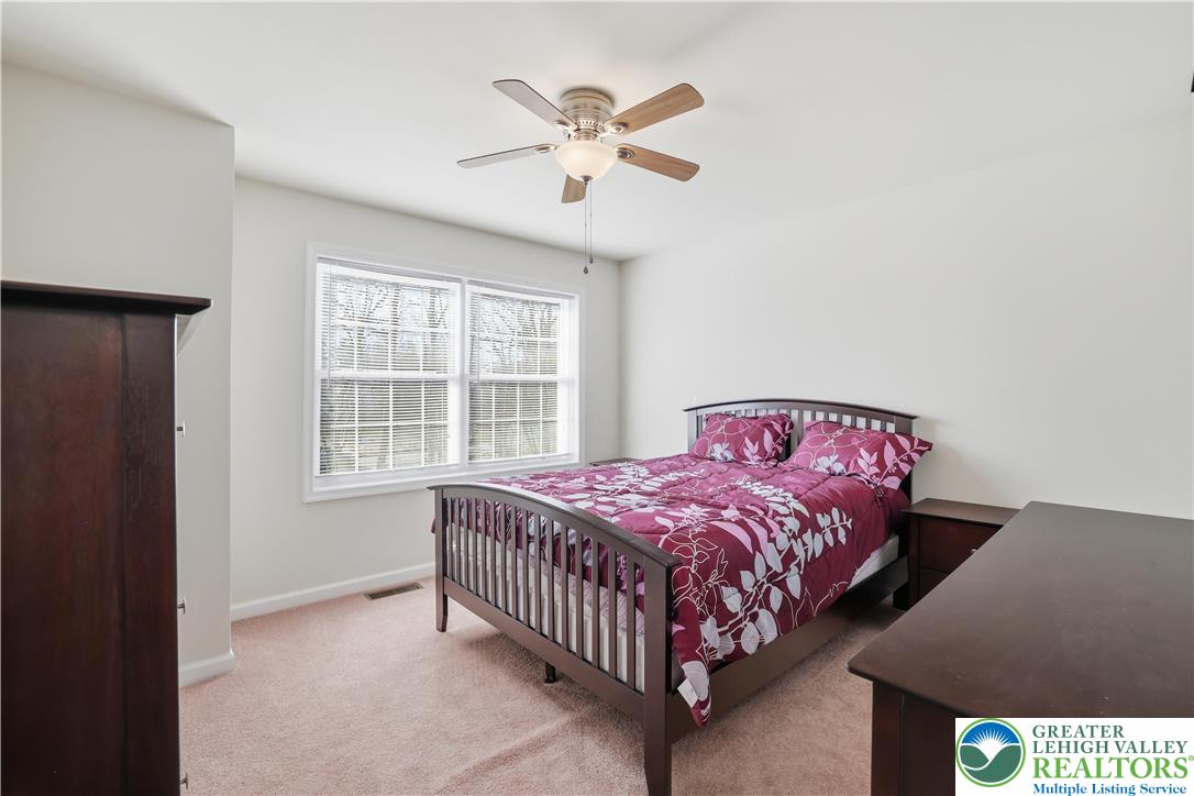112 Amos Circle Bushkill, PA 18324 - Photo 21 of 52 a bedroom with a bed and window