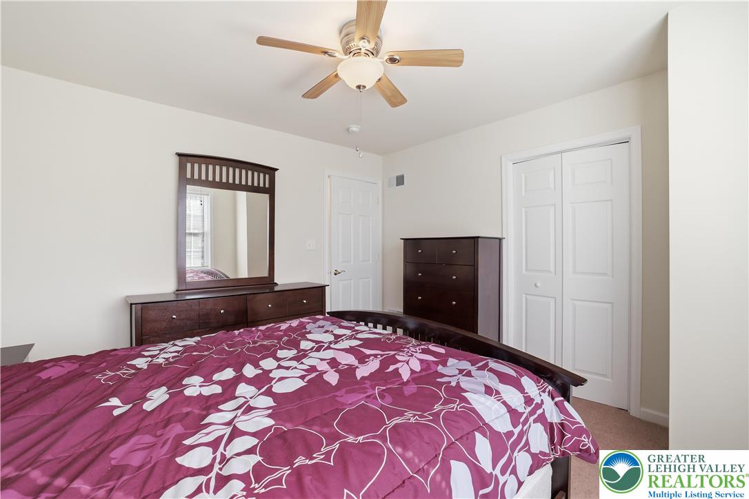 112 Amos Circle Bushkill, PA 18324 - Photo 22 of 52 a bedroom with a bed and a dresser