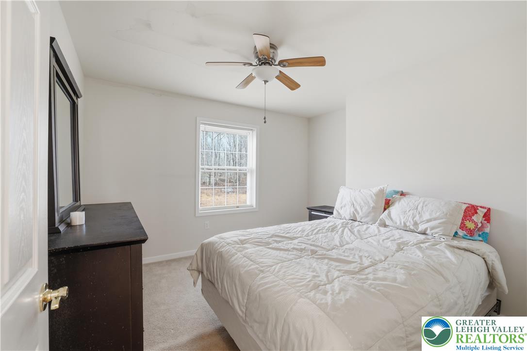 112 Amos Circle Bushkill, PA 18324 - Photo 24 of 52 a bedroom with a bed and a window