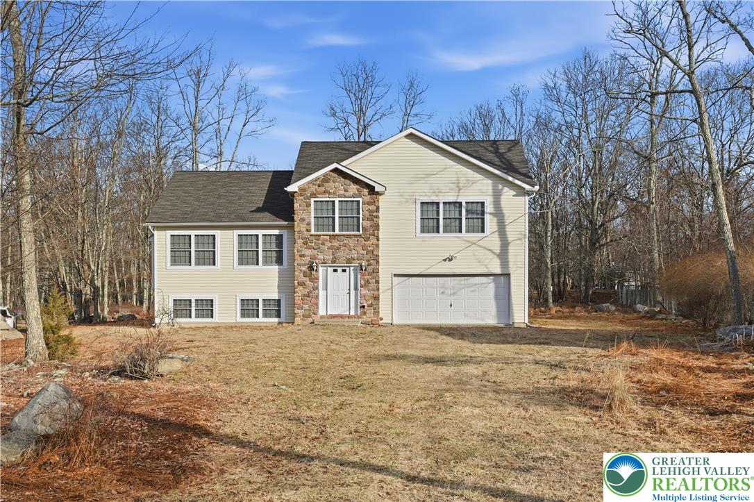 112 Amos Circle Bushkill, PA 18324 - Photo 32 of 52 a front view of a house with a yard