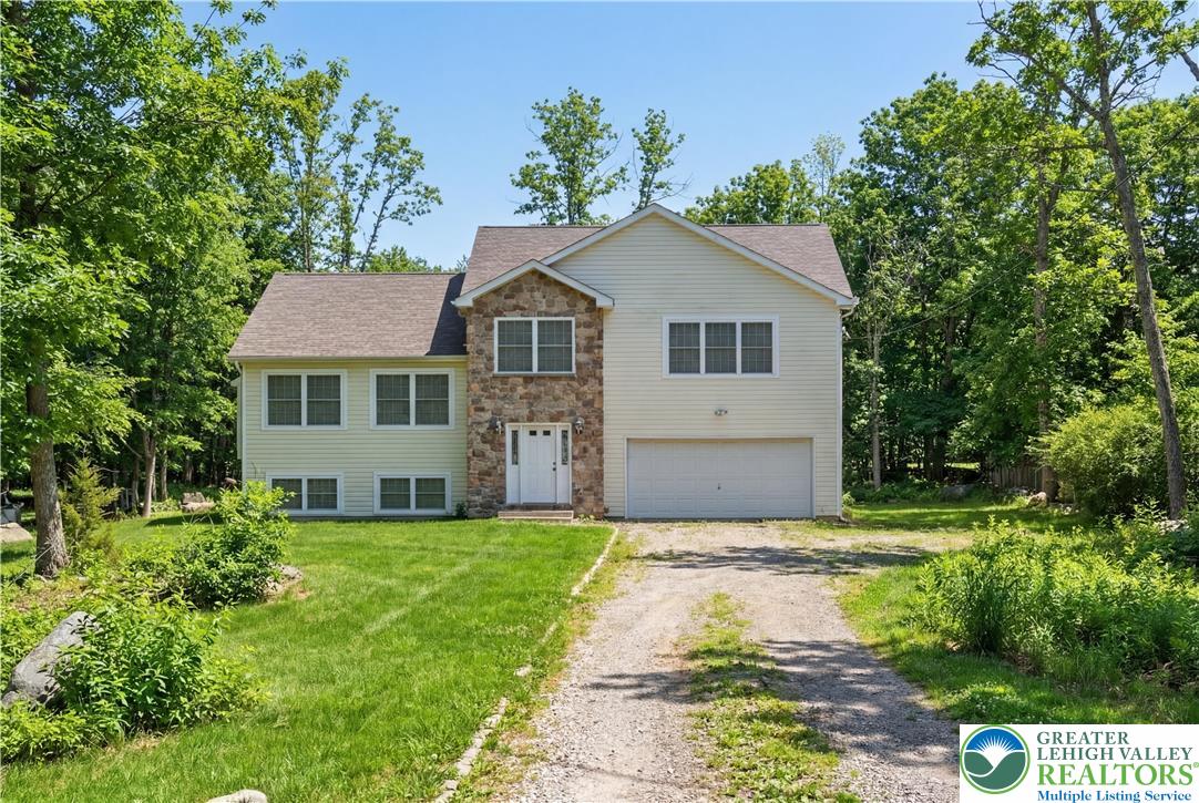 112 Amos Circle Bushkill, PA 18324 - Photo 47 of 52 a front view of a house with a yard