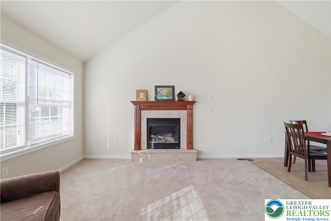 112 Amos Circle Bushkill, PA 18324 - Photo 5 of 52 a view of a livingroom with a fireplace and window