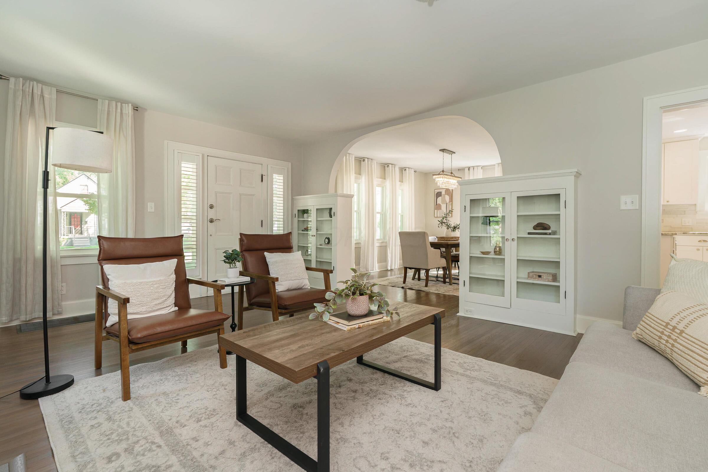 163 Garden Road Columbus, OH 43214 - Photo 7 of 46 Step inside to discover beautiful wood floors, archways and built-ins in this generous living room.