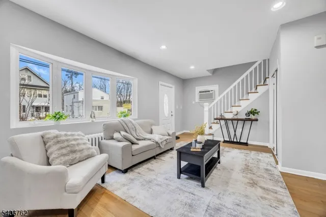 a living room with furniture and a table