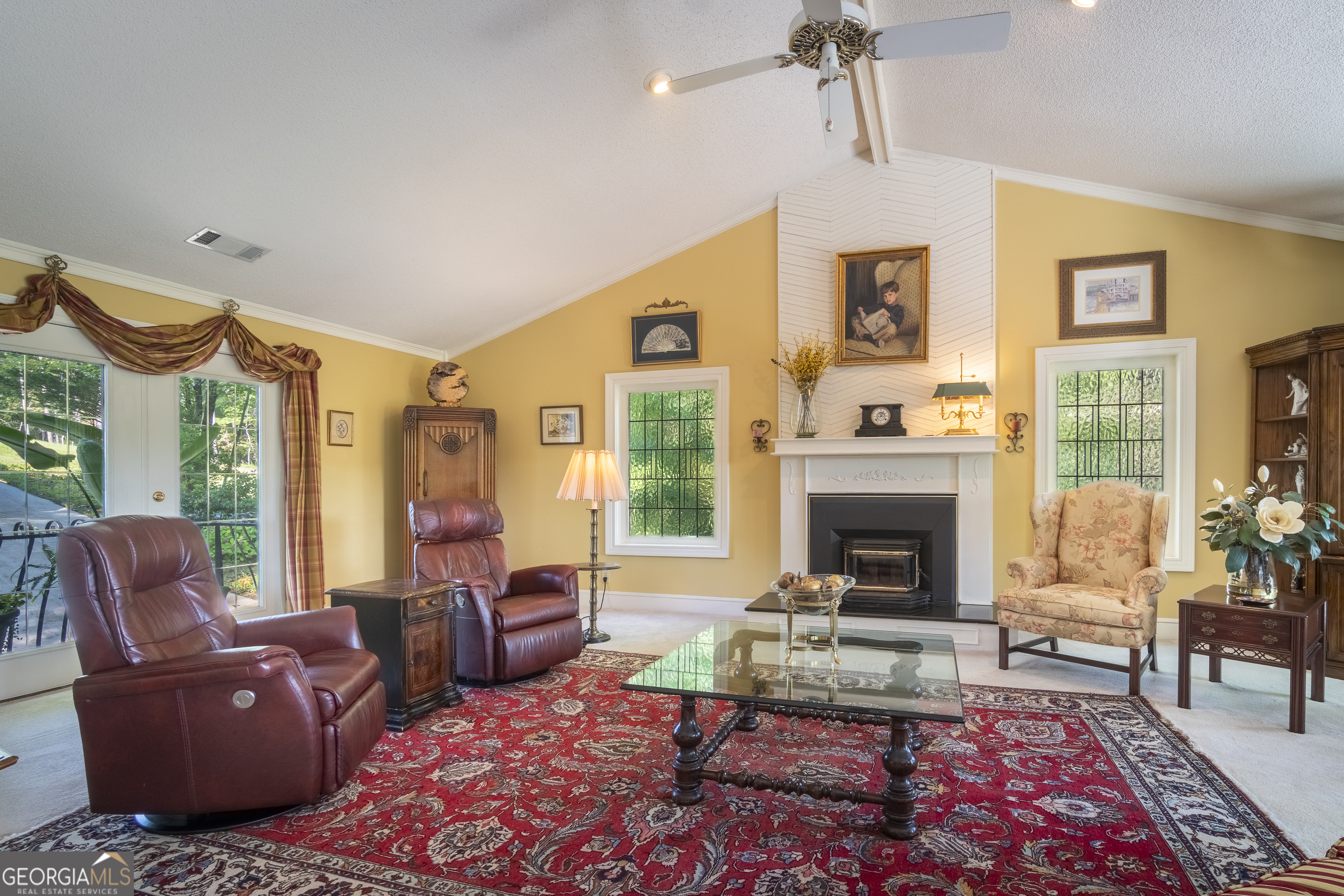 1280 Bahn Innsbruck Helen, GA 30545 - Photo 19 of 85 a living room with furniture fireplace and a large window