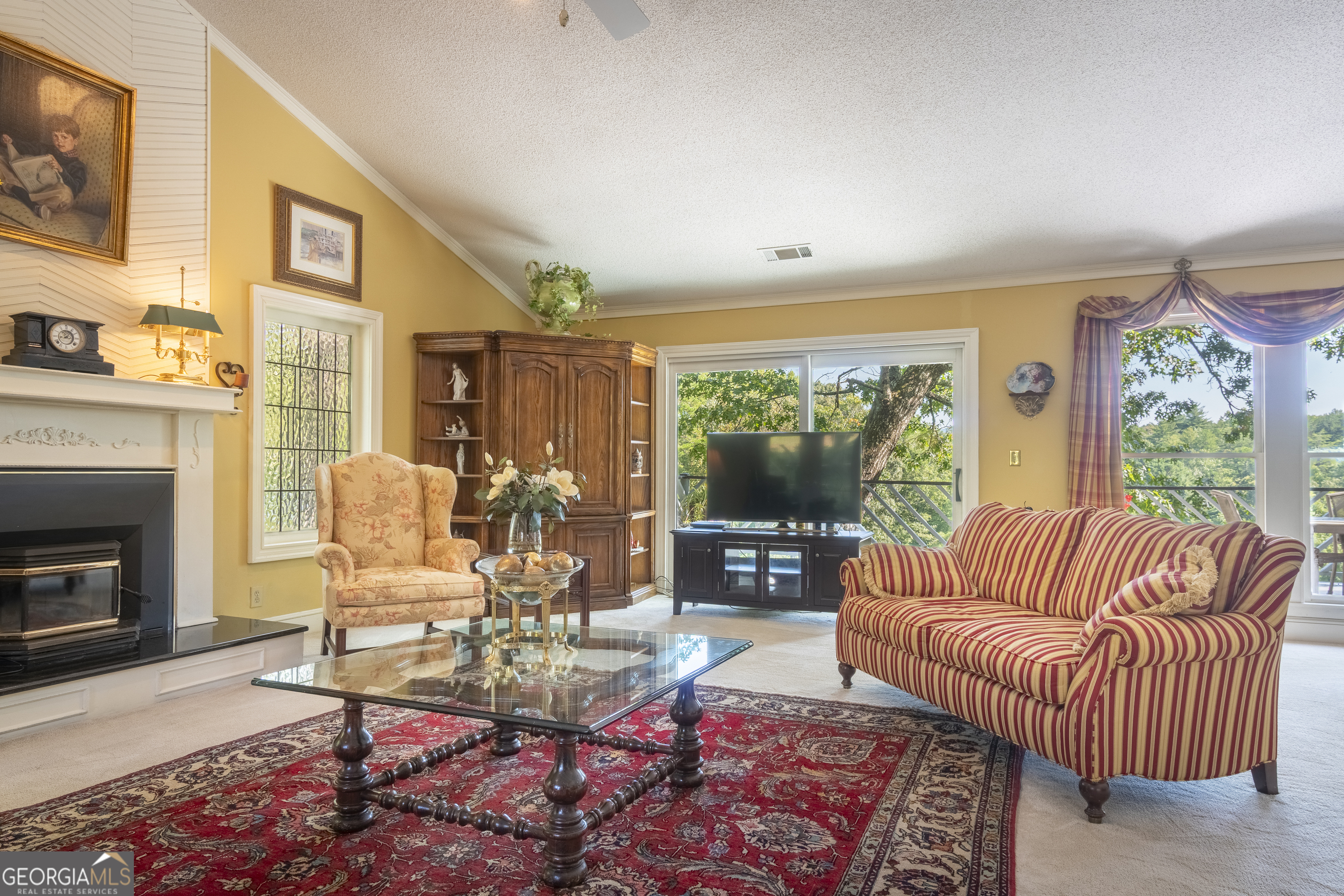 1280 Bahn Innsbruck Helen, GA 30545 - Photo 23 of 85 a living room with furniture fireplace and a large window