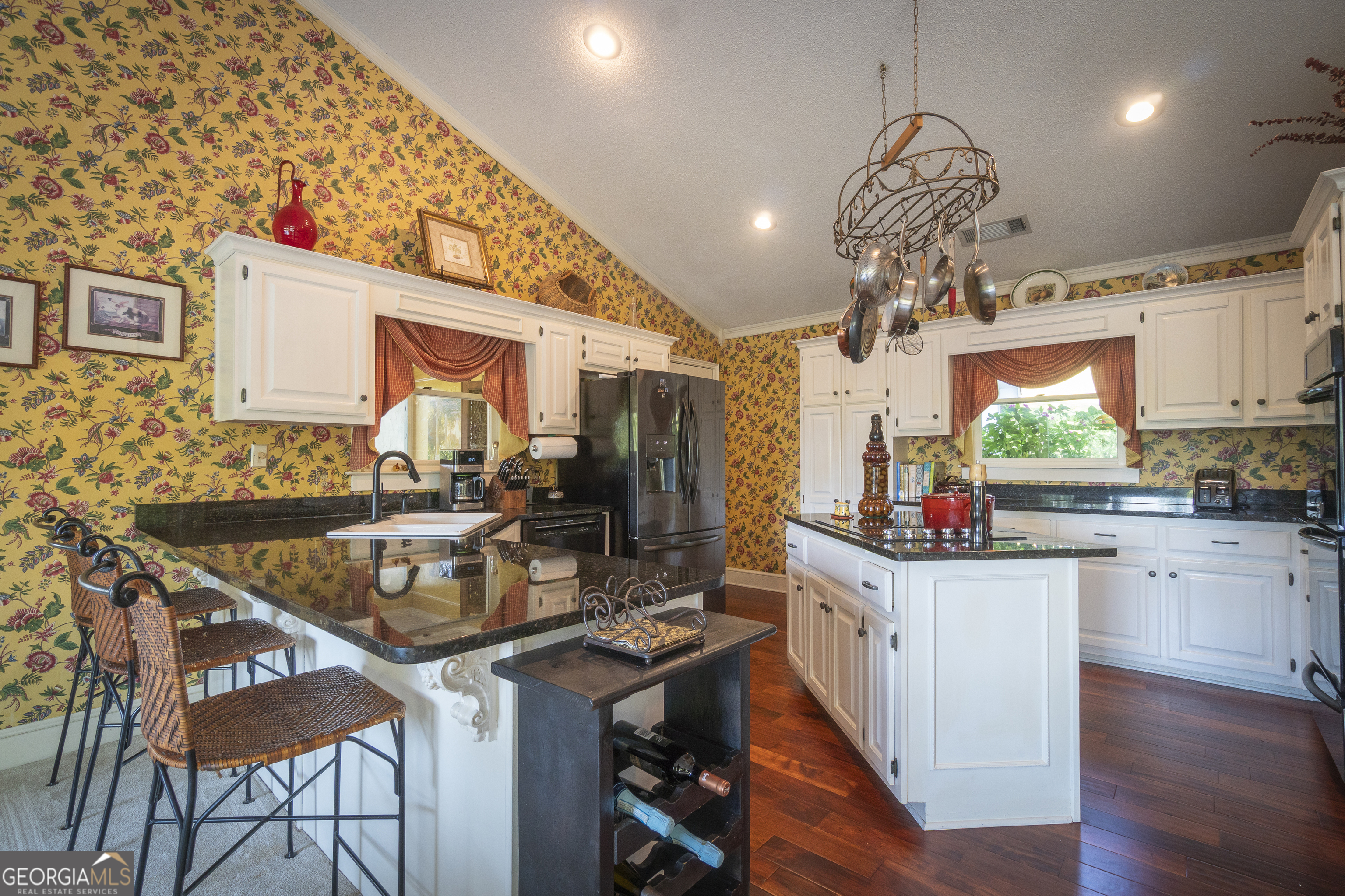 1280 Bahn Innsbruck Helen, GA 30545 - Photo 37 of 85 a kitchen with stainless steel appliances granite countertop a sink stove and refrigerator