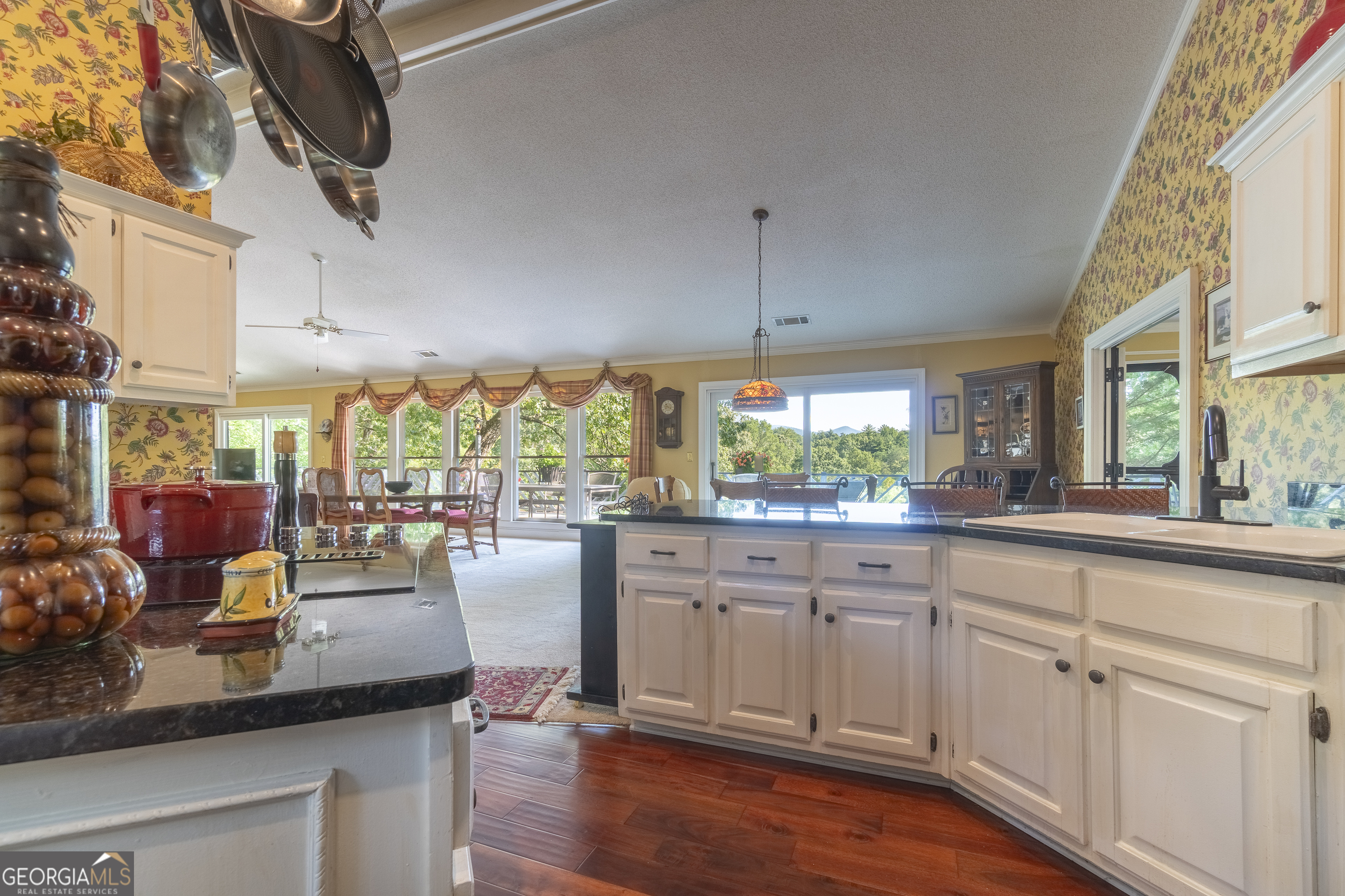 1280 Bahn Innsbruck Helen, GA 30545 - Photo 40 of 85 a kitchen with sink cabinets and wooden floor