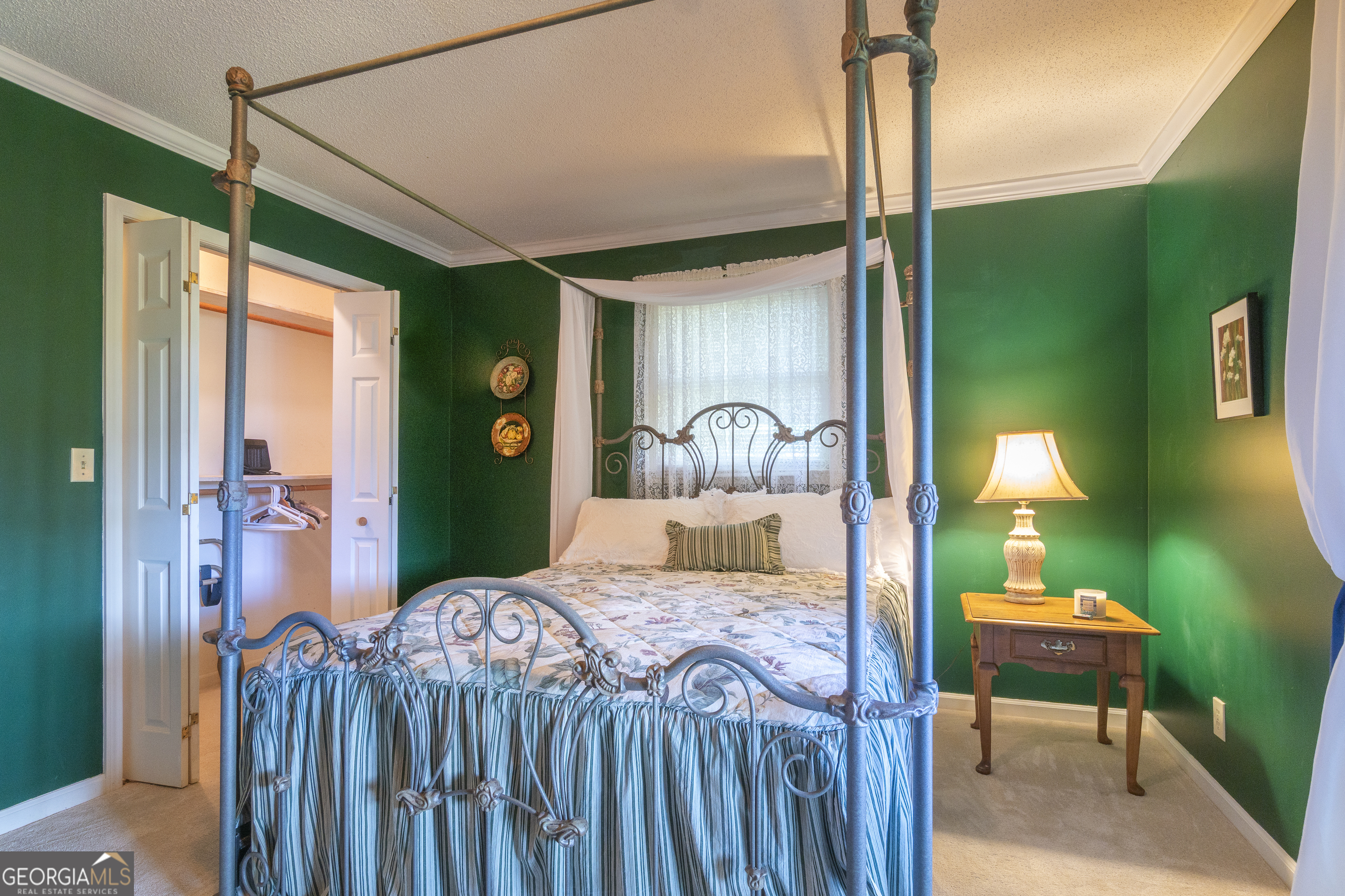 1280 Bahn Innsbruck Helen, GA 30545 - Photo 57 of 85 a bedroom with a bed window and a chandelier
