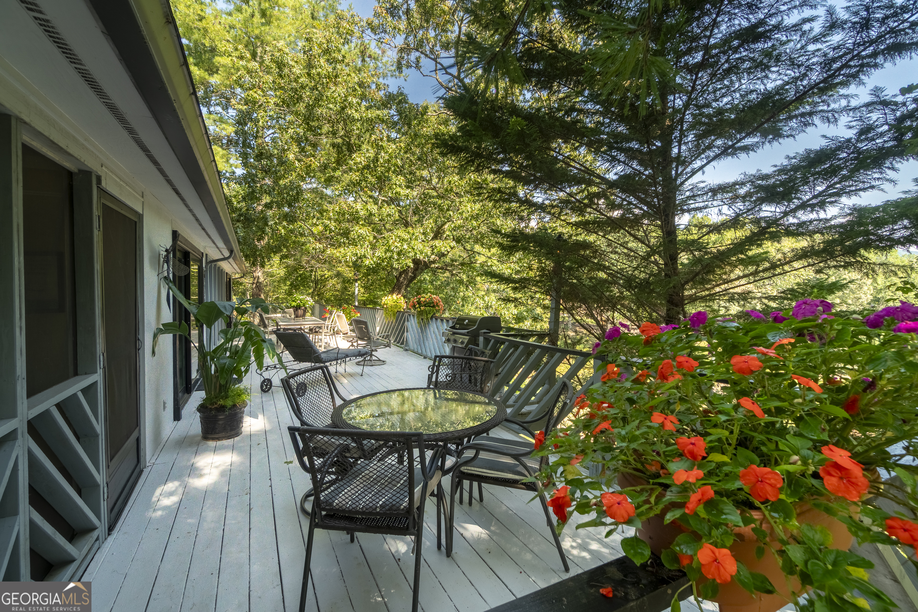 1280 Bahn Innsbruck Helen, GA 30545 - Photo 9 of 85 a backyard of a house with table and chairs wooden floor and fence