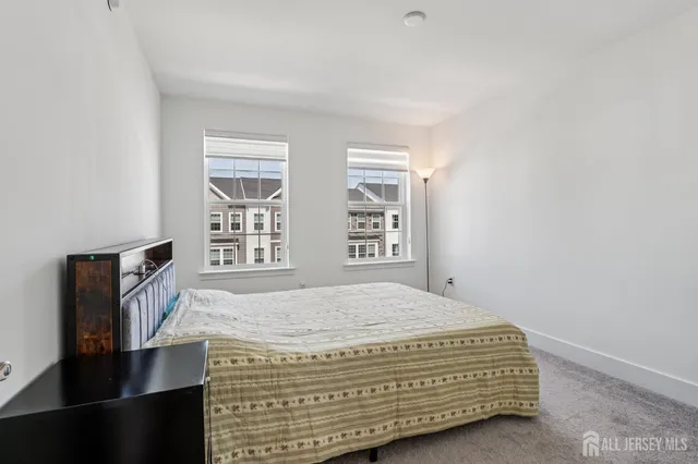 a view of a livingroom with furniture and a window