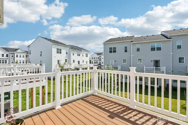 a swimming pool with yard in front of it
