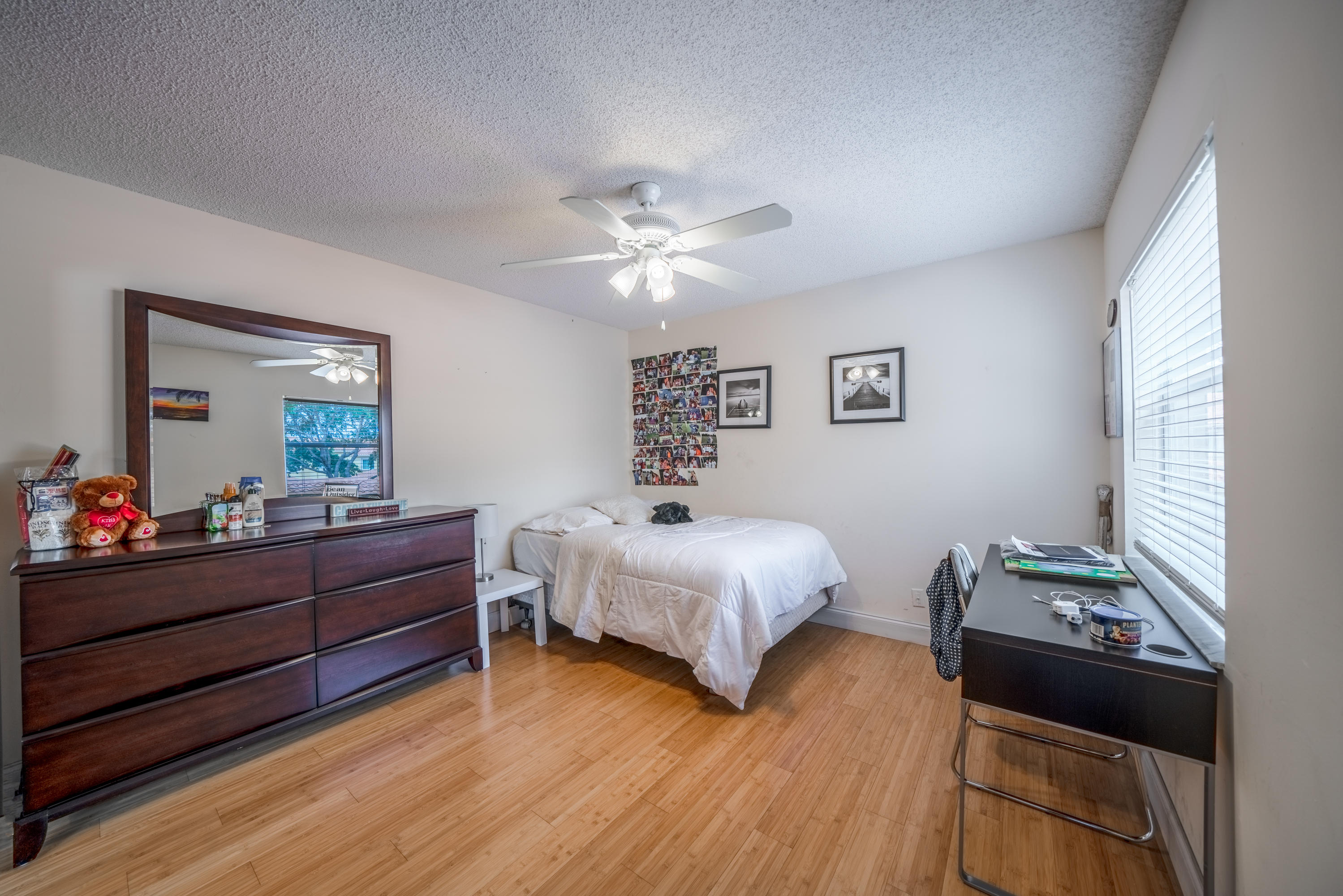 10399 Lake Vista Circle Boca Raton, FL 33498 - Photo 12 of 18 a bed room with bed and window
