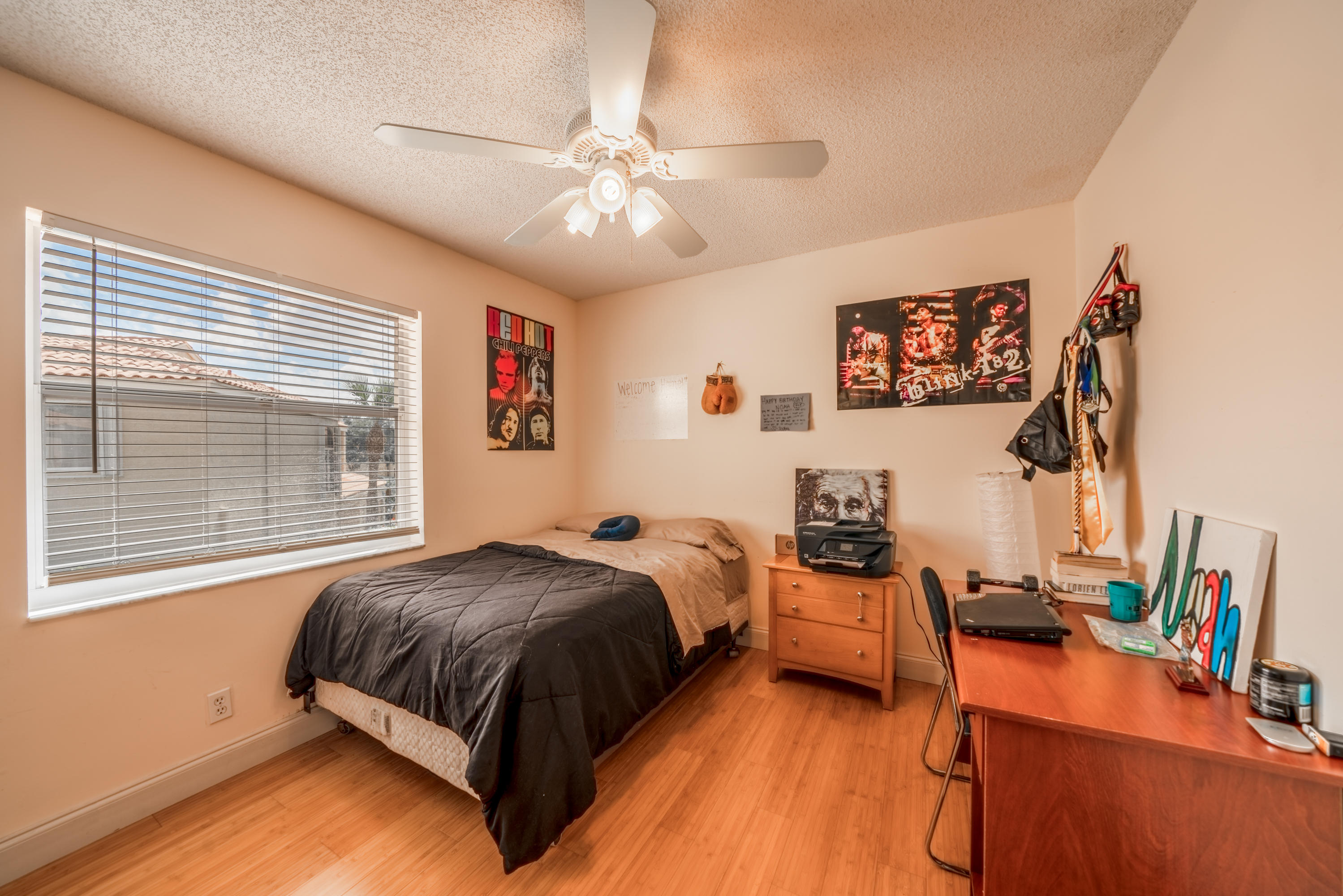 10399 Lake Vista Circle Boca Raton, FL 33498 - Photo 14 of 18 a bedroom with a bed and wooden floor