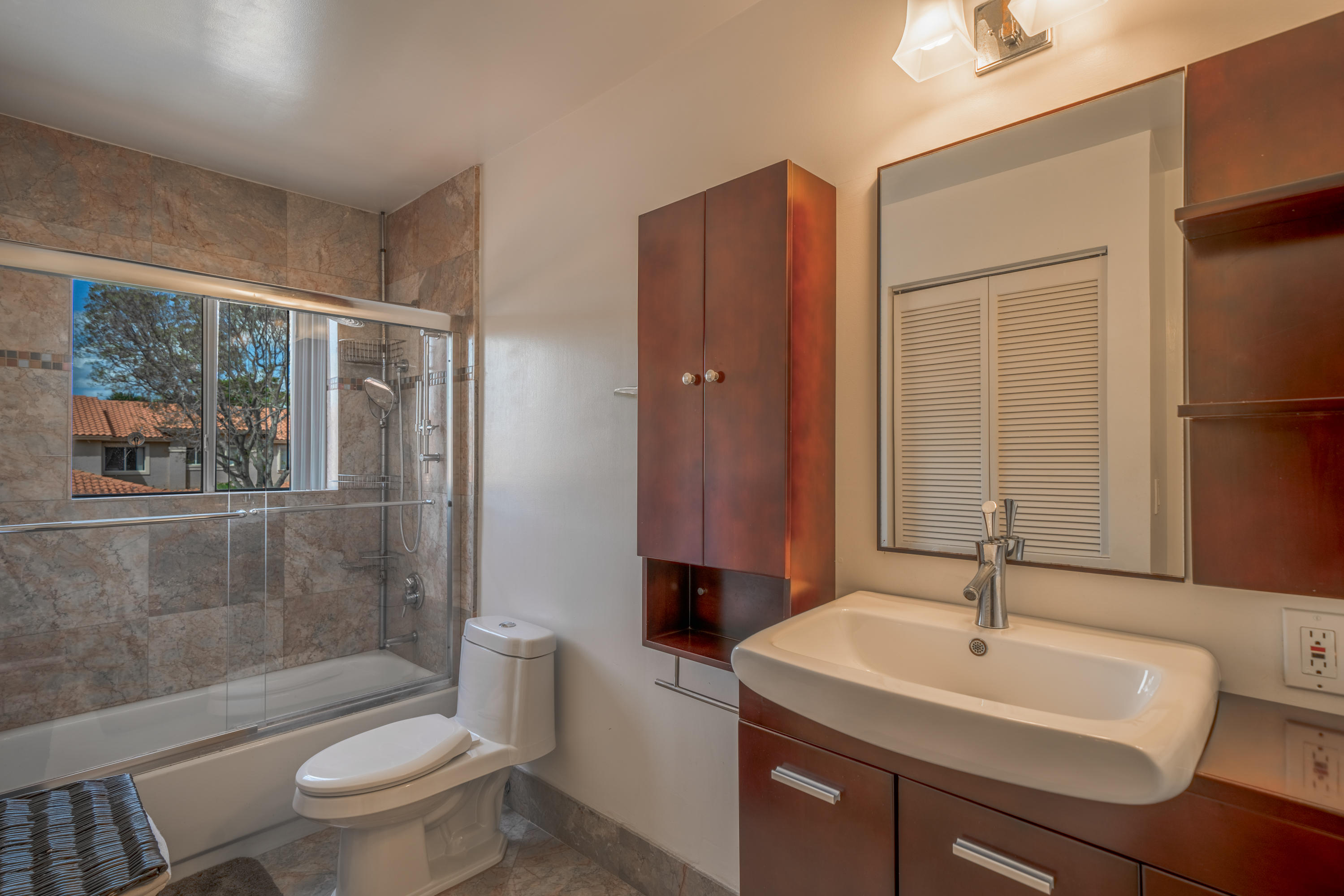 10399 Lake Vista Circle Boca Raton, FL 33498 - Photo 15 of 18 a bathroom with a sink toilet and shower