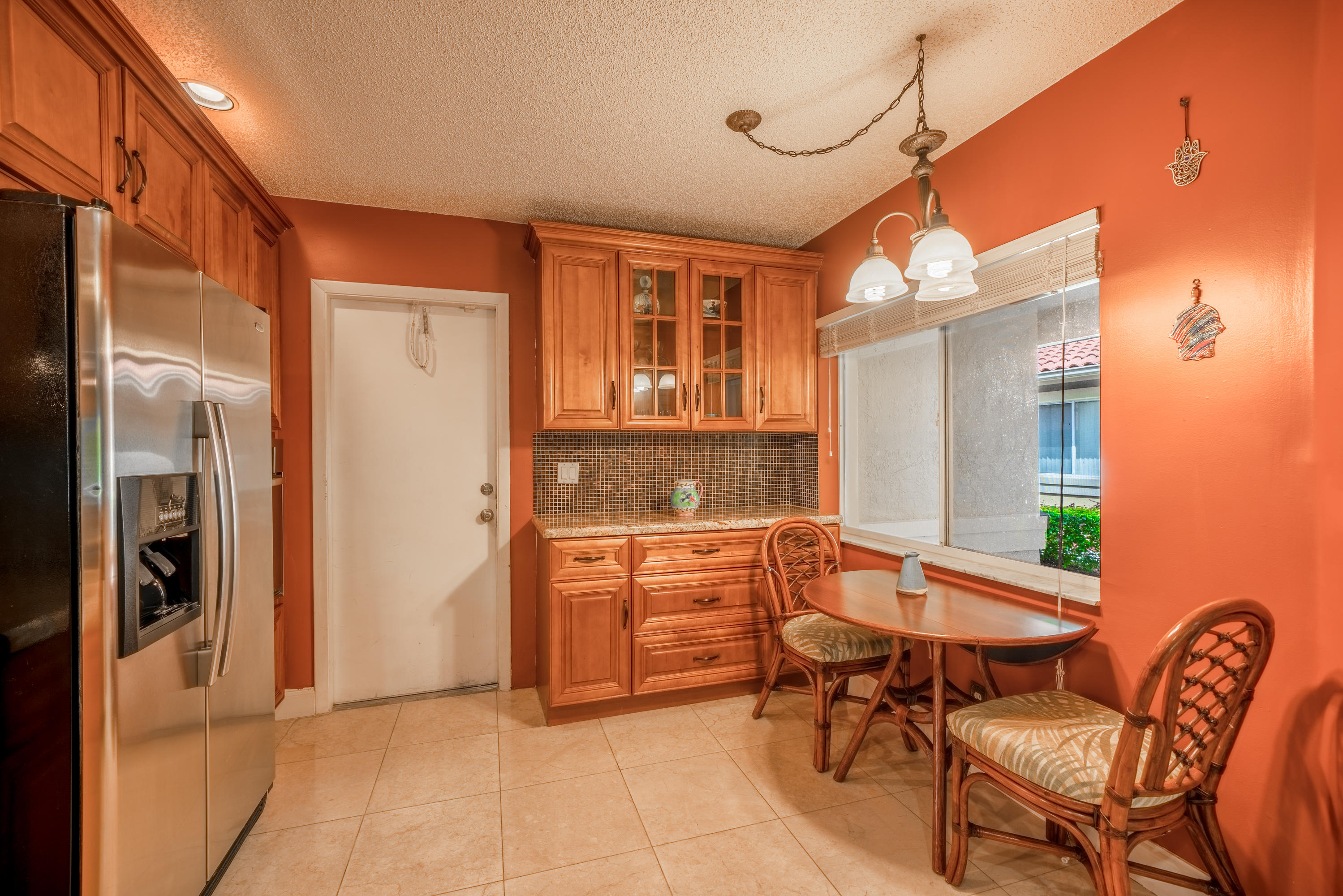 10399 Lake Vista Circle Boca Raton, FL 33498 - Photo 3 of 18 a view of a dining room and chairs in a room