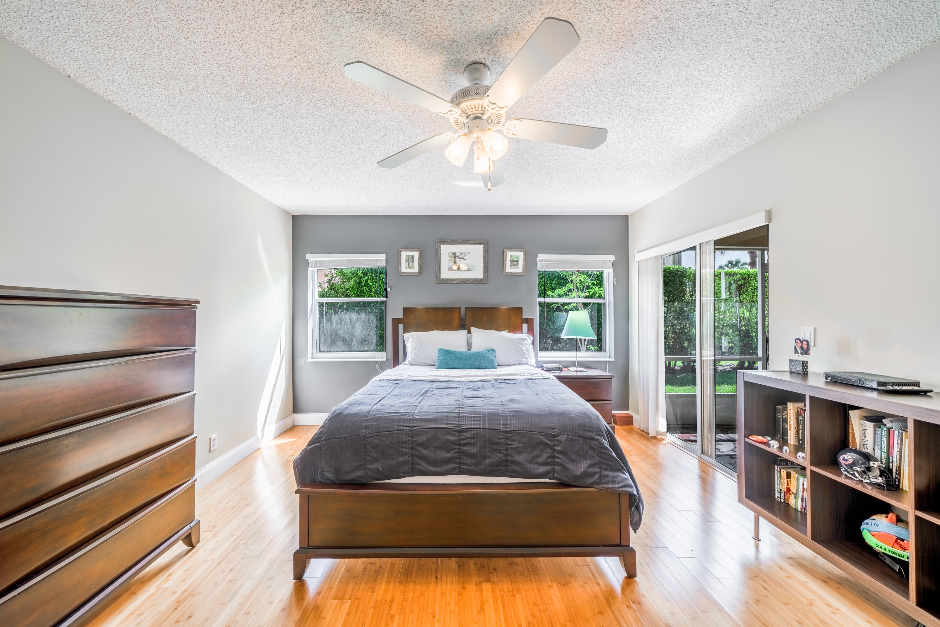 10399 Lake Vista Circle Boca Raton, FL 33498 - Photo 8 of 18 a bed sitting in a bedroom next to a window