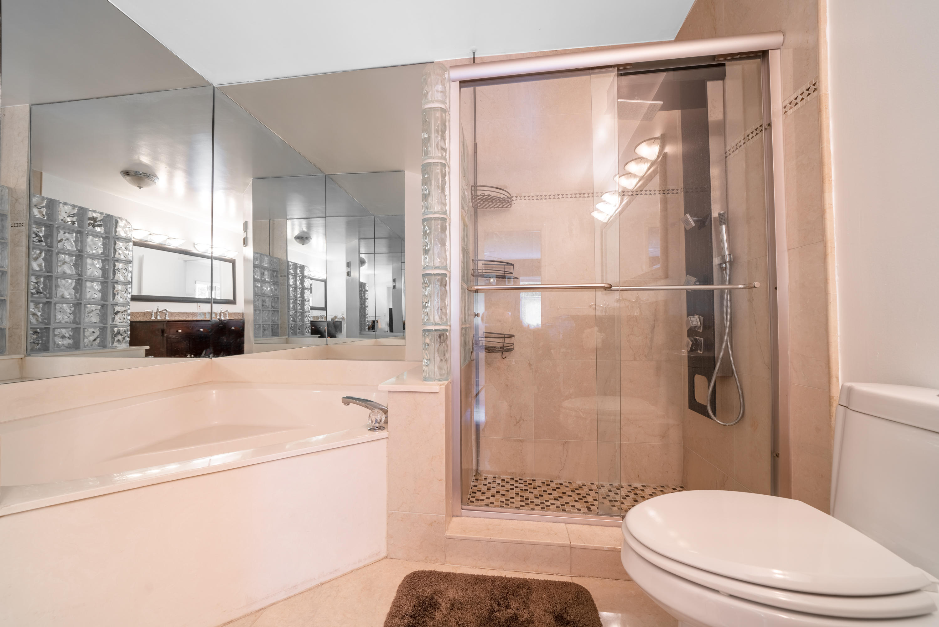 10399 Lake Vista Circle Boca Raton, FL 33498 - Photo 10 of 18 a bathroom with a sink toilet and shower