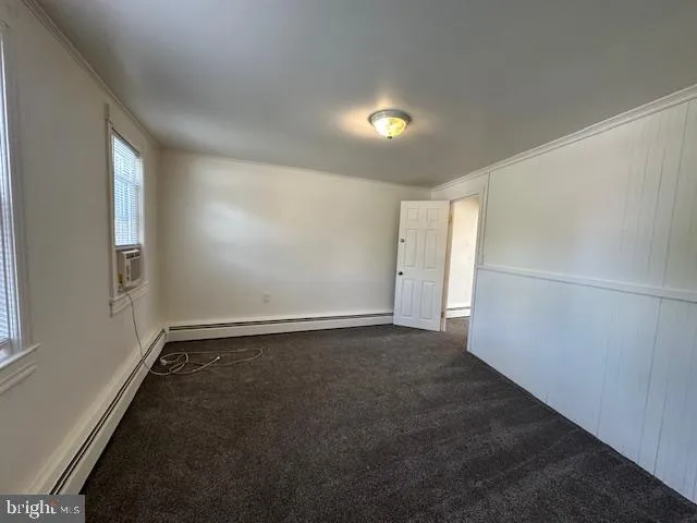 a white toilet sitting next to a bathroom sink and a shower