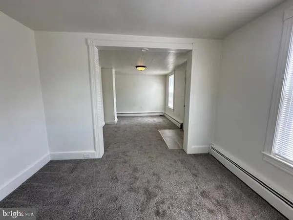 an empty room with a empty space and window