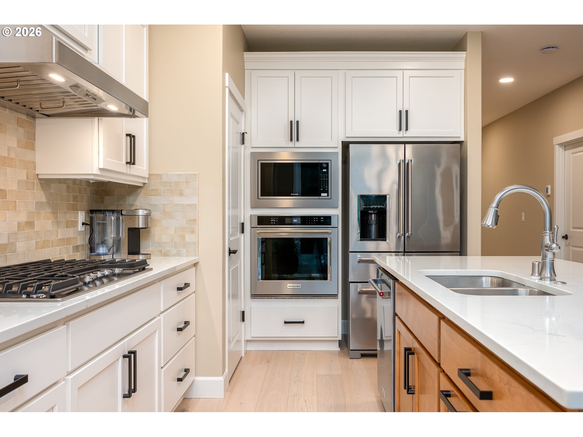 Undisclosed Address Ridgefield, WA 98642 - Photo 11 of 46 a kitchen with kitchen island a sink stove and refrigerator