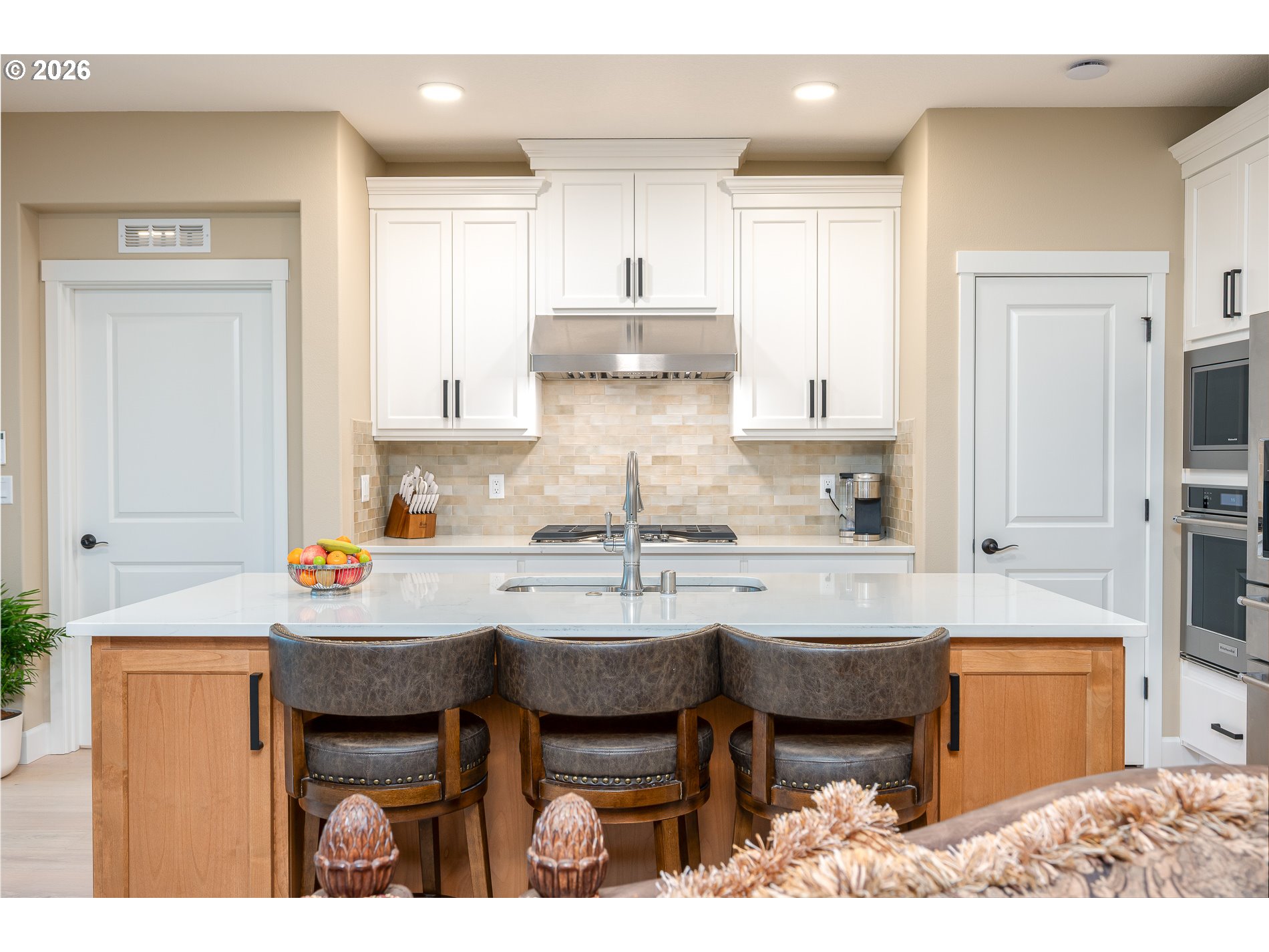 Undisclosed Address Ridgefield, WA 98642 - Photo 12 of 46 a kitchen with kitchen island granite countertop a table and chairs in it