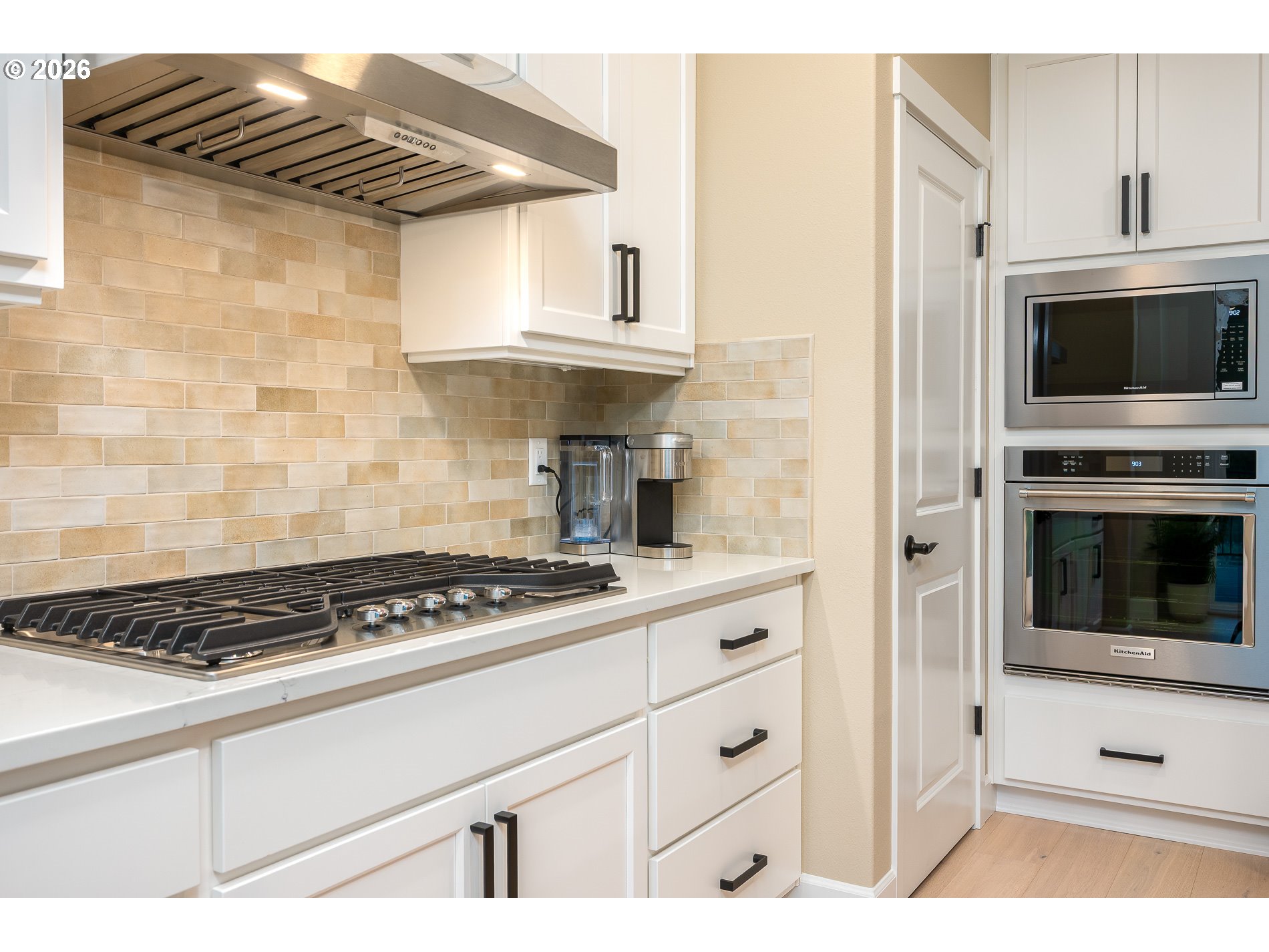 Undisclosed Address Ridgefield, WA 98642 - Photo 14 of 46 a kitchen with granite countertop a stove and a microwave