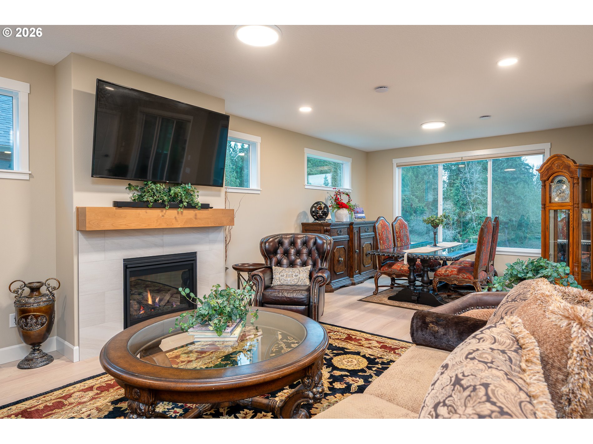 Undisclosed Address Ridgefield, WA 98642 - Photo 18 of 46 a living room with furniture a fireplace and a flat screen tv