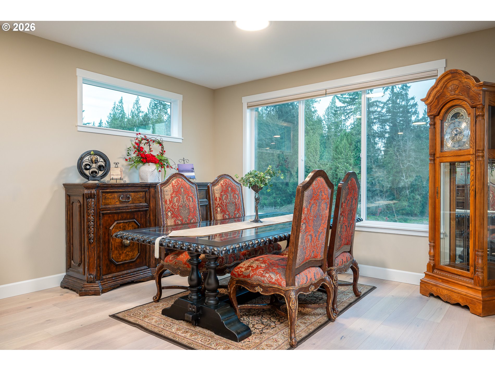 Undisclosed Address Ridgefield, WA 98642 - Photo 20 of 46 a dining room with furniture a fireplace and a large window