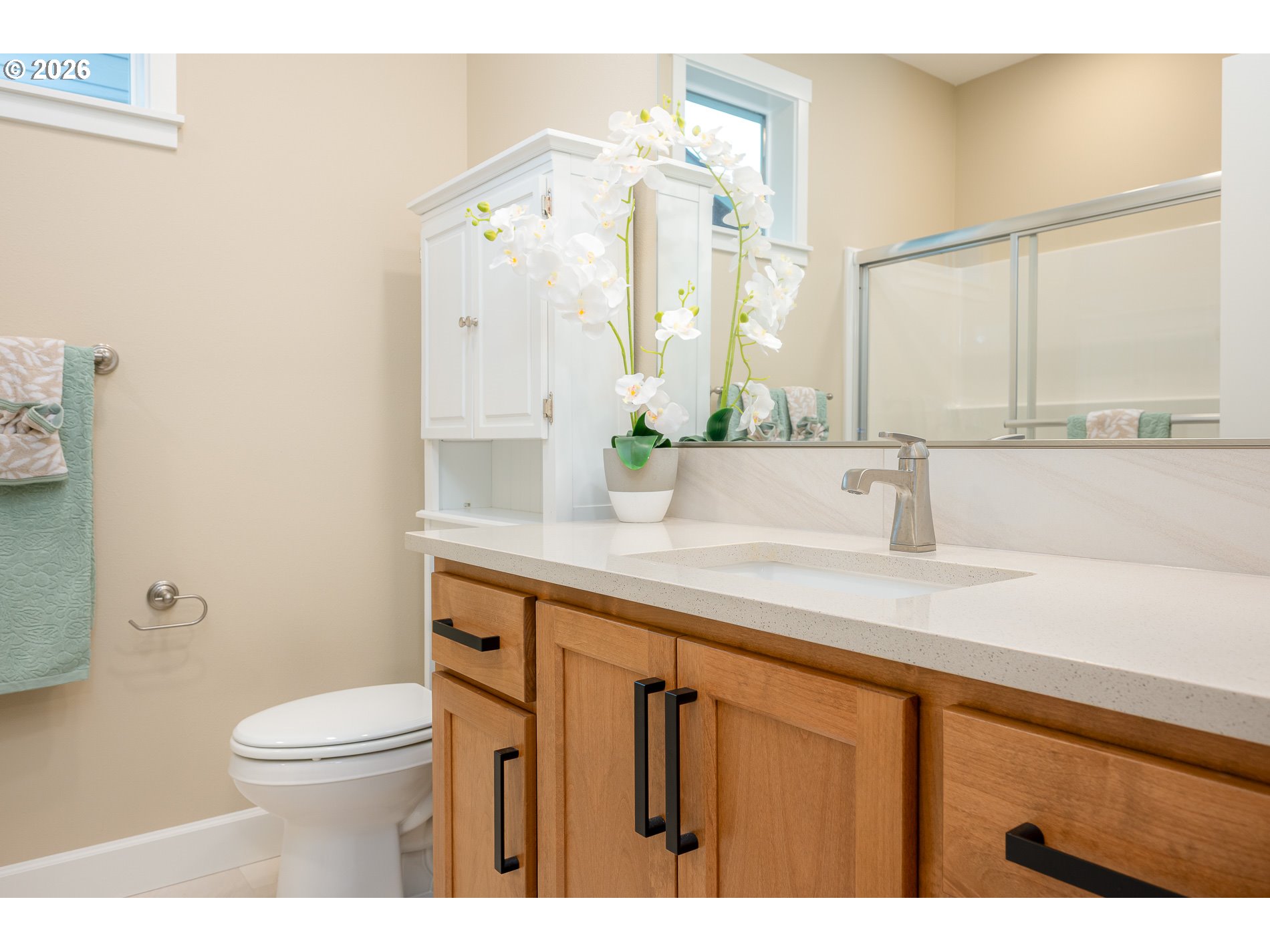 Undisclosed Address Ridgefield, WA 98642 - Photo 29 of 46 a bathroom with a sink a toilet and a mirror
