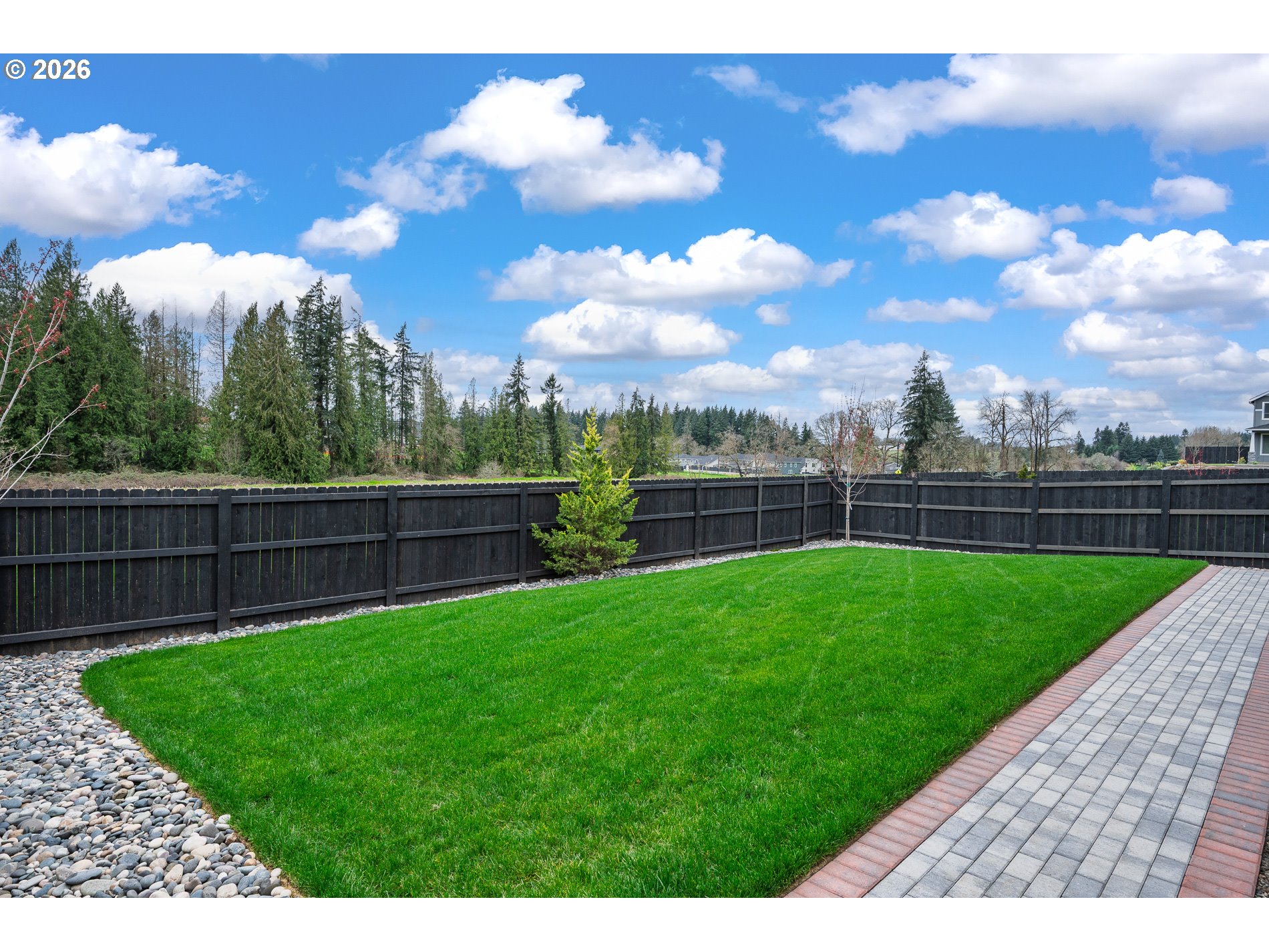 Undisclosed Address Ridgefield, WA 98642 - Photo 44 of 46 a view of a backyard with a garden