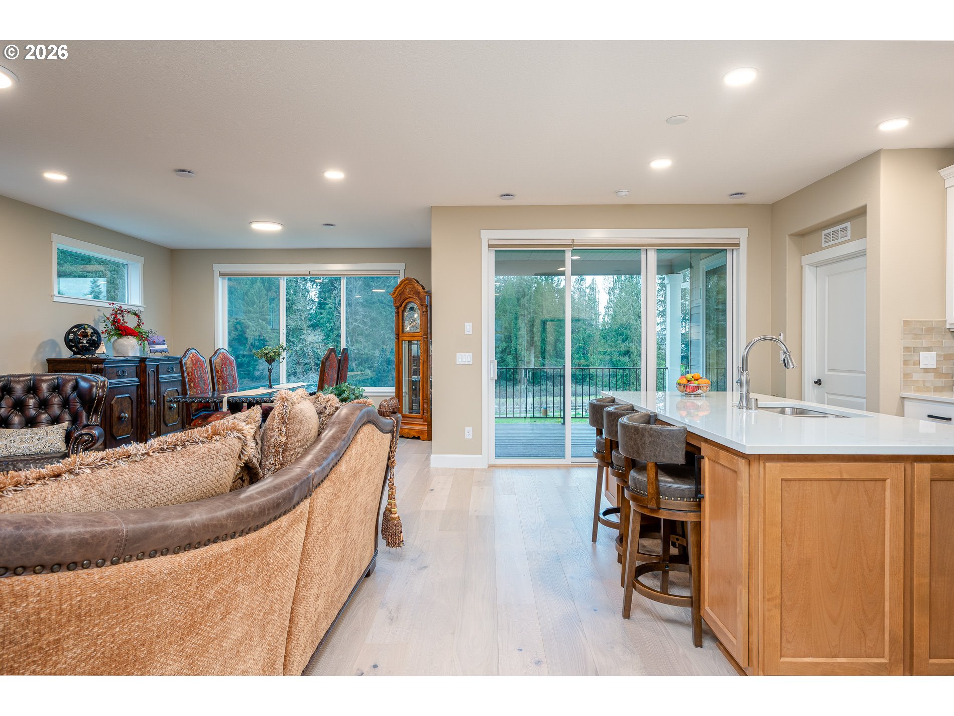 Undisclosed Address Ridgefield, WA 98642 - Photo 6 of 46 a living room with furniture a large window and a dining table