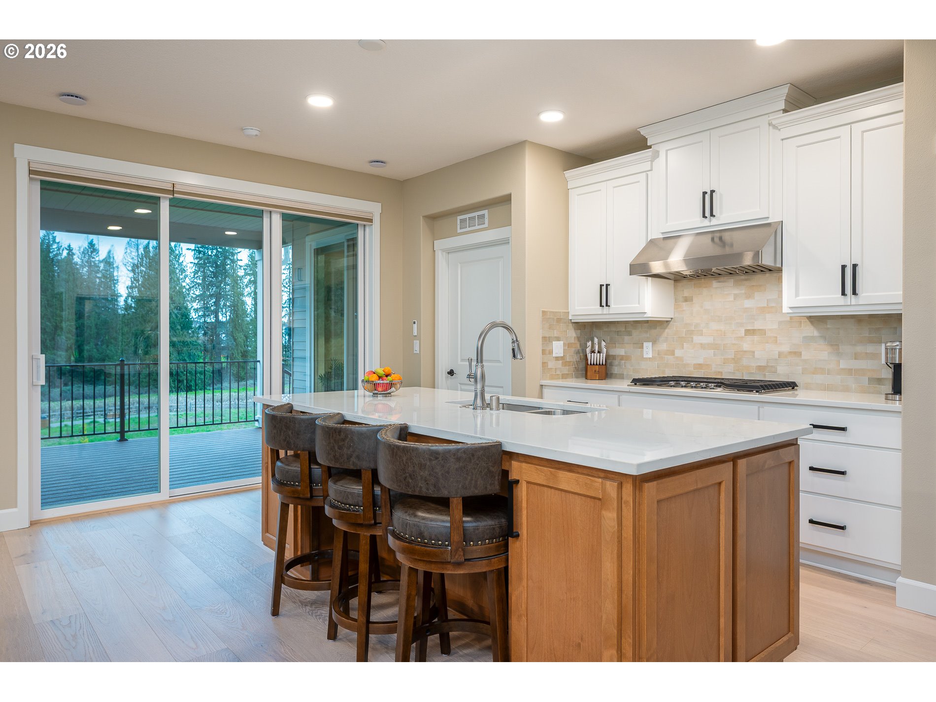 Undisclosed Address Ridgefield, WA 98642 - Photo 7 of 46 a kitchen with stainless steel appliances granite countertop a stove a refrigerator a sink and white cabinets with wooden floor