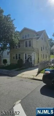 a front view of a house with yard