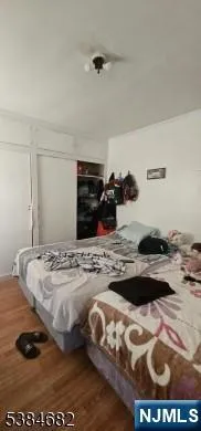 a bedroom with bed and window