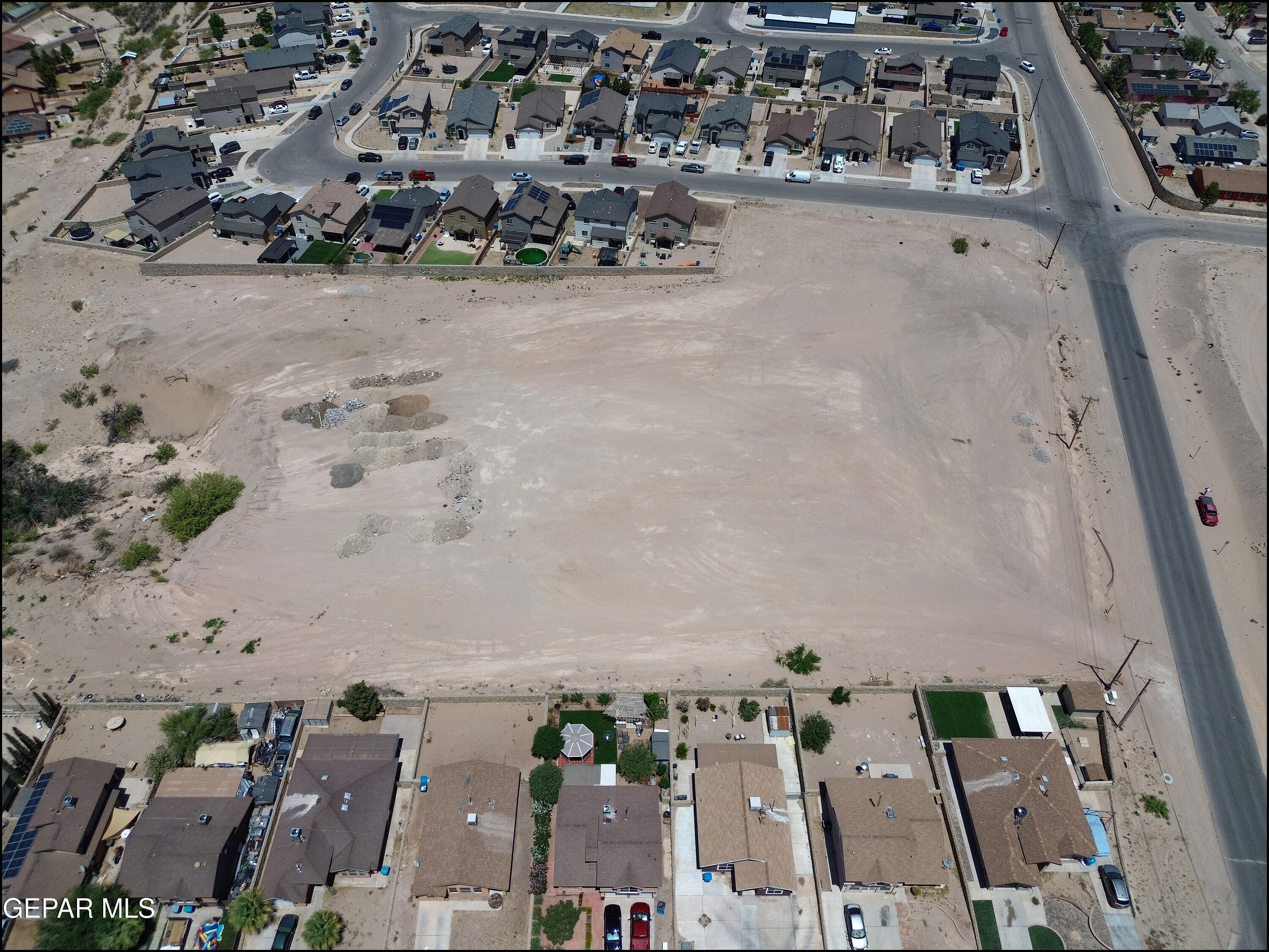 10696 Stockyard Drive Socorro, TX 79927 - Photo 5 of 7 an aerial view of a residential apartment building with outdoor space
