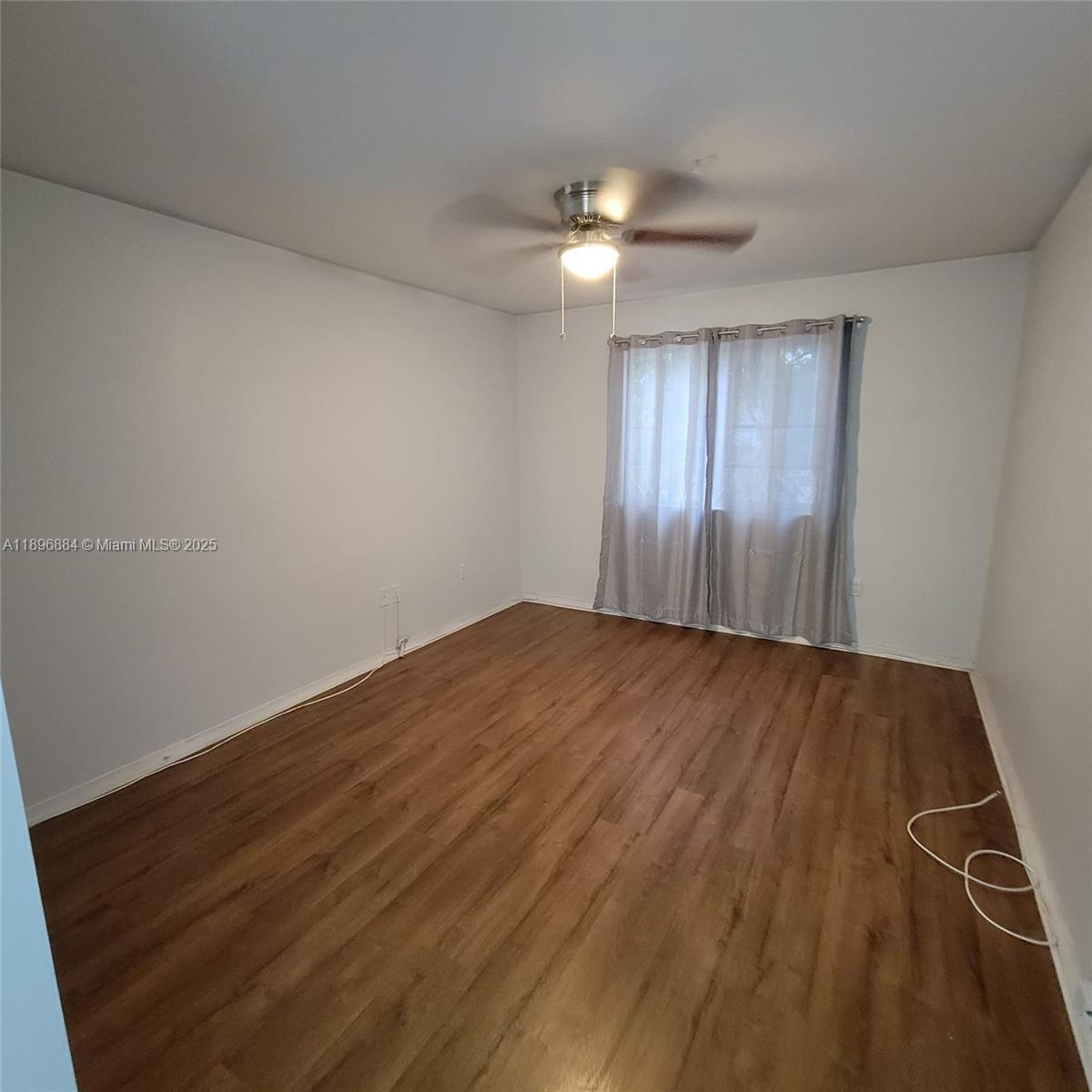 711 Southwest 111th Way, Unit 301 Pembroke Pines, FL 33025 - Photo 16 of 20 wooden floor in an empty room