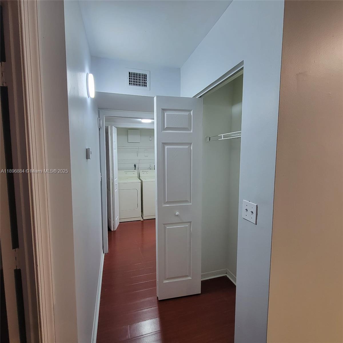 711 Southwest 111th Way, Unit 301 Pembroke Pines, FL 33025 - Photo 8 of 20 a view of a hallway with wooden floor