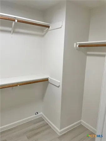 a view of an empty walk in closet