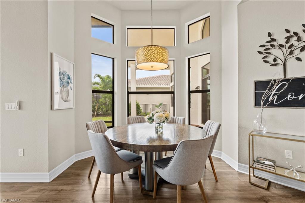 4644 Azalea Drive Naples, FL 34119 - Photo 14 of 48 a view of a dining room with furniture window and outside view