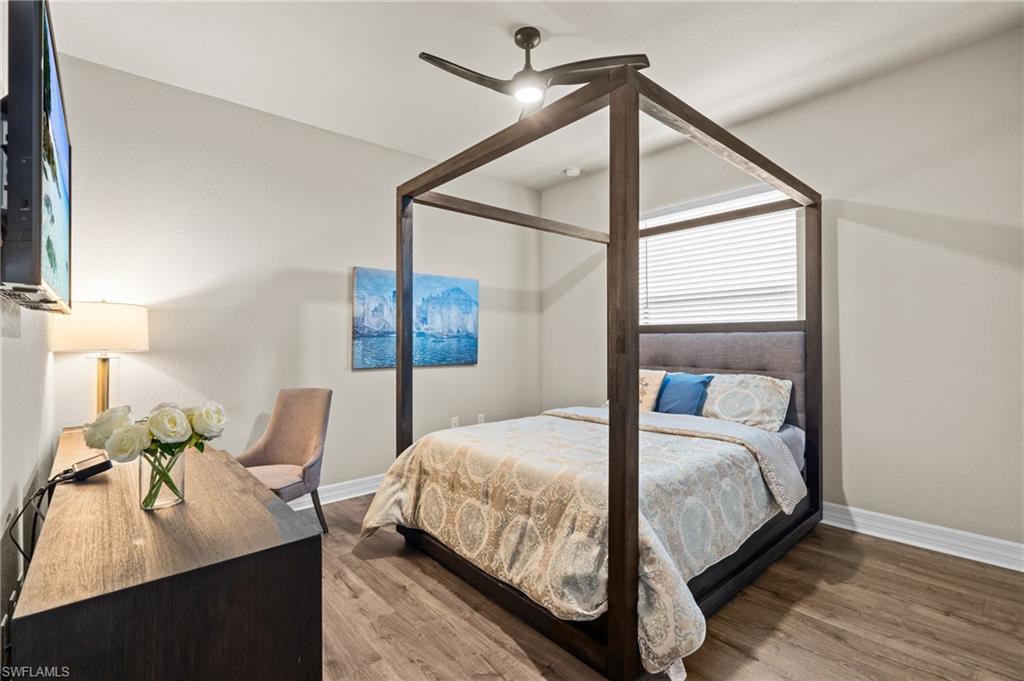 4644 Azalea Drive Naples, FL 34119 - Photo 19 of 48 a bedroom with a bed and a window