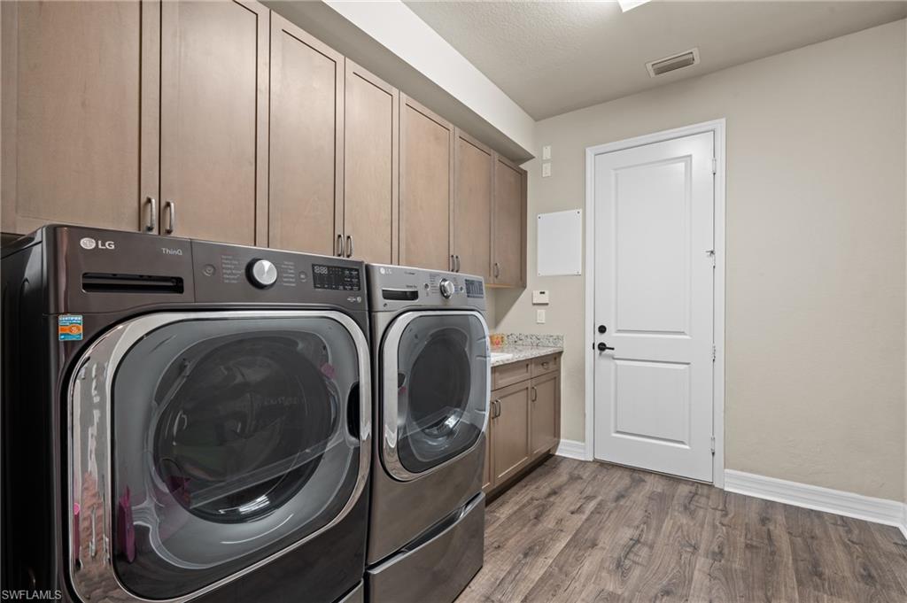 4644 Azalea Drive Naples, FL 34119 - Photo 21 of 48 a utility room with dryer and washer